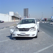 Poor corolla in the side of the road