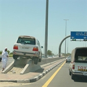 Driving land cruiser on the median in Dubai