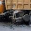 Land Cruiser smashed under a big truck wheels